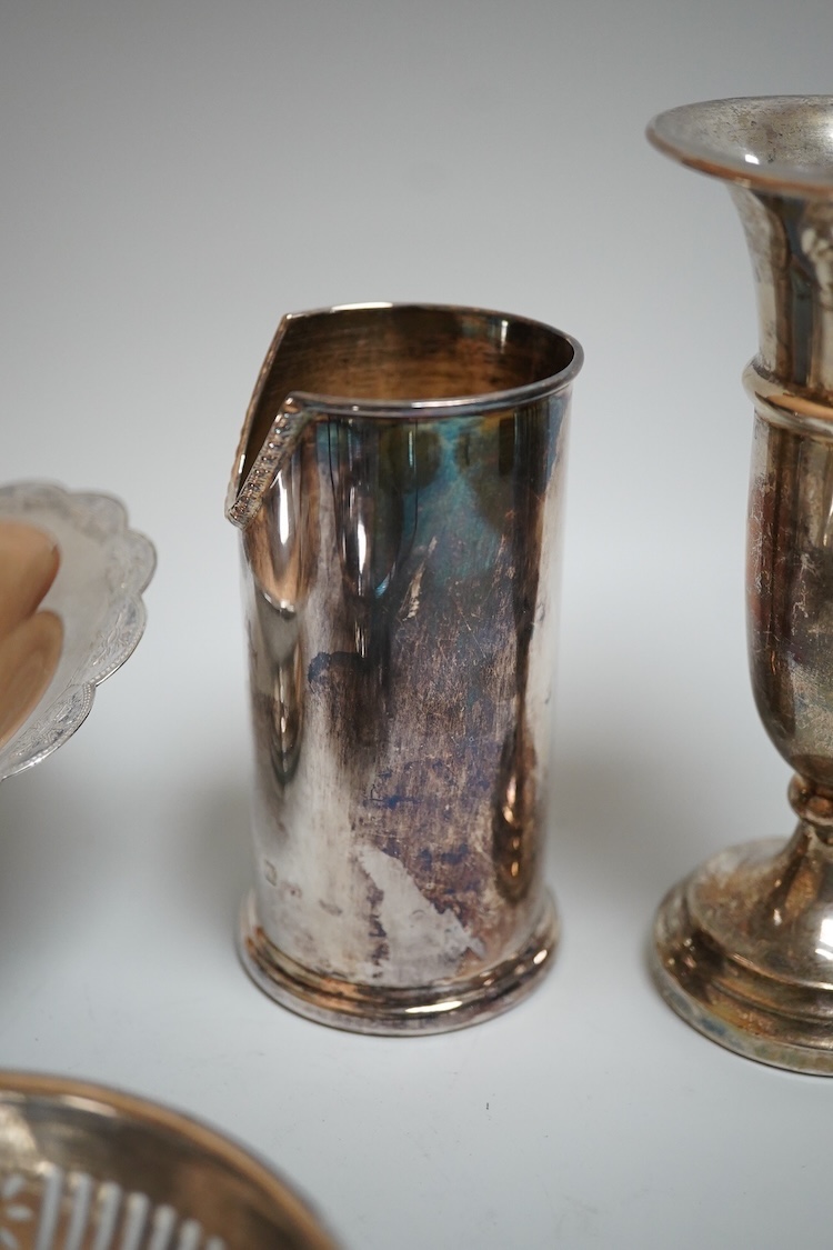 A modern silver oval pedestal sweetmeat bowl, by Mappin & Webb, Birmingham, 1987, 15.8cm, together with a small silver bottle holder, a silver mounted vase and a sterling two handled nut dish.